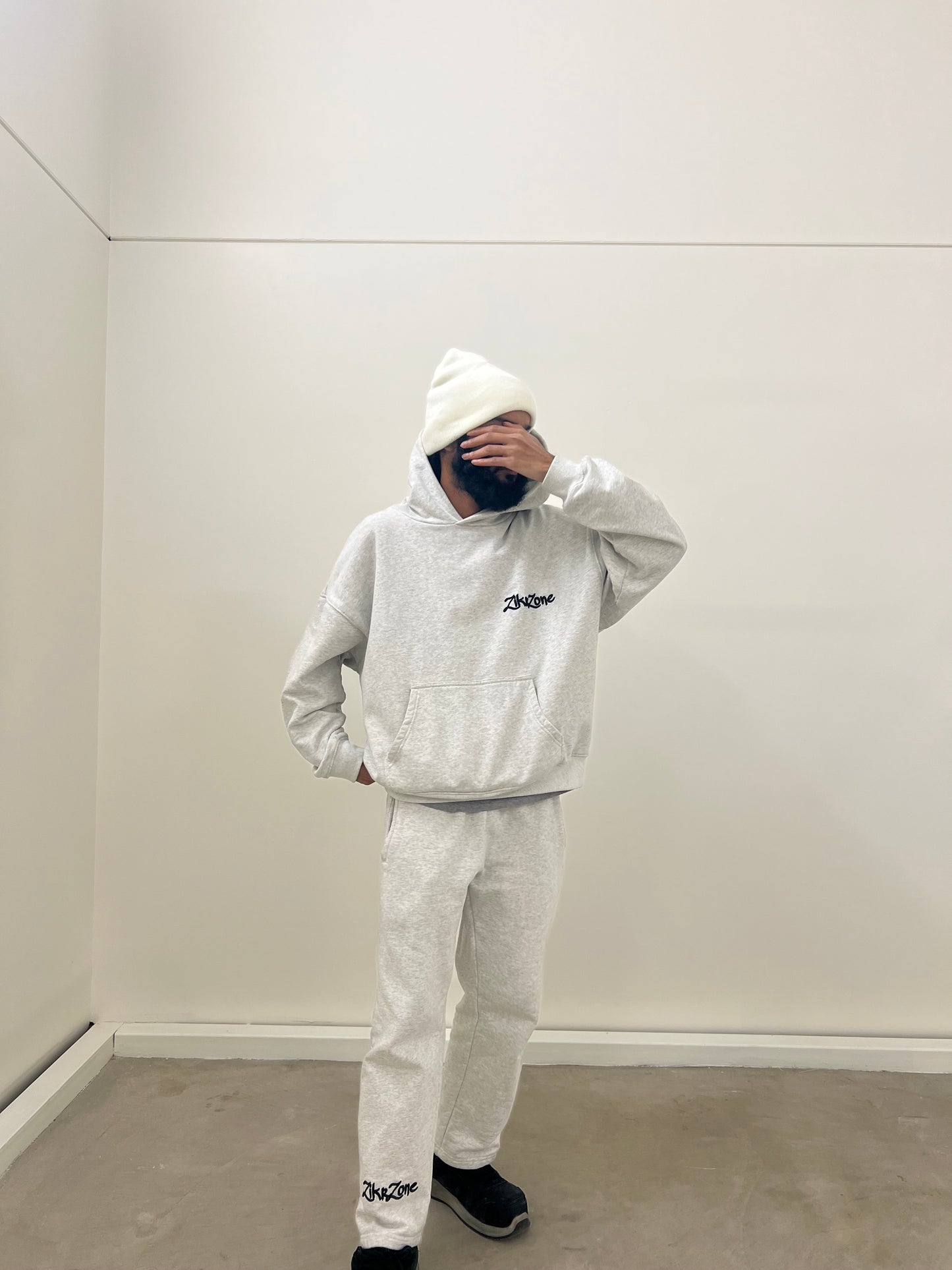 Light gray oversized hoodie with black embroidery