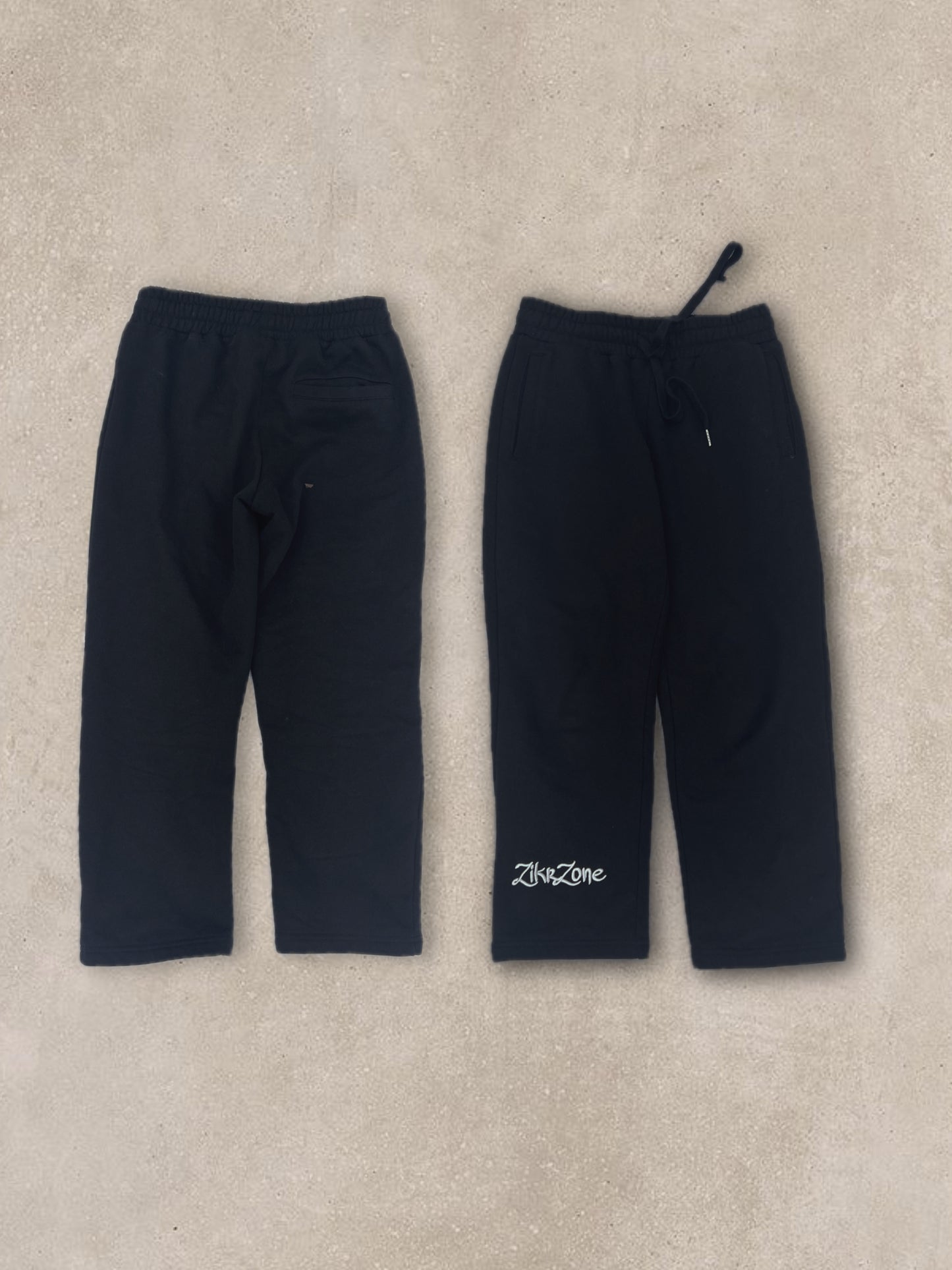 Black pants with white embroidery