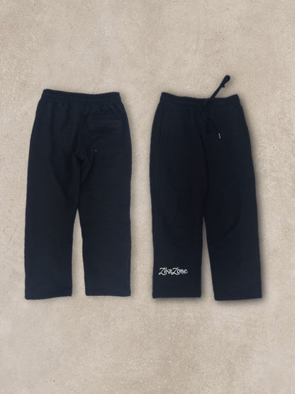 Black pants with white embroidery