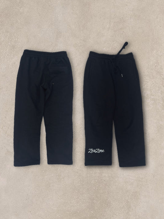 Black pants with white embroidery